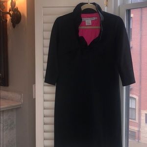 Black knee length dress with standup ruffle collar